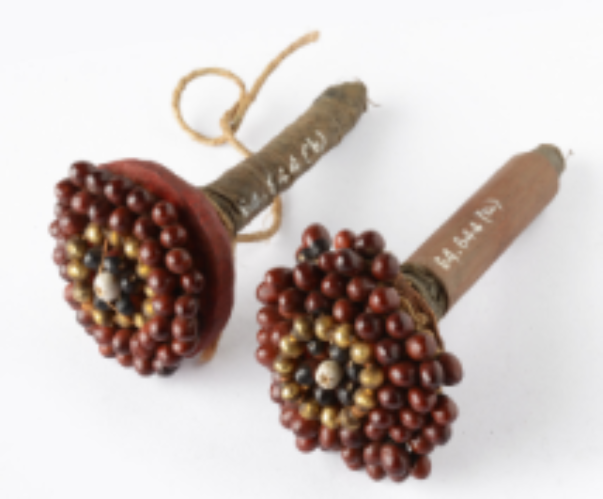 Crafted with red seeds and bamboo Crafted with red seeds and bamboo