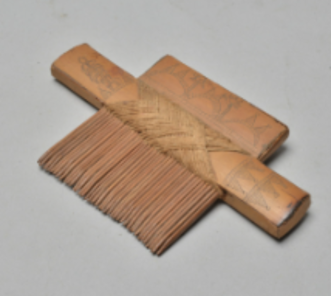 A Bamboo Comb with poker work A Bamboo Comb with poker work