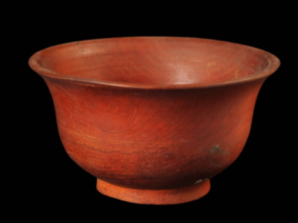 A traditional red-painted wooden cup A traditional red-painted wooden cup
