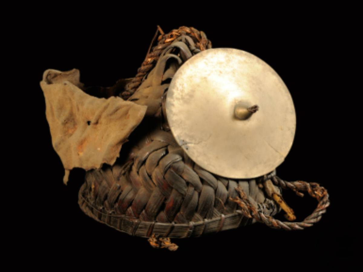 A conical helmet crafted from cane and bamboo A conical helmet crafted from cane and bamboo