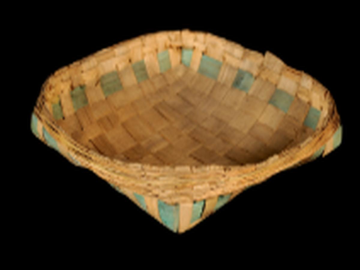 Squarish basket with four prominent corners Squarish basket with four prominent corners