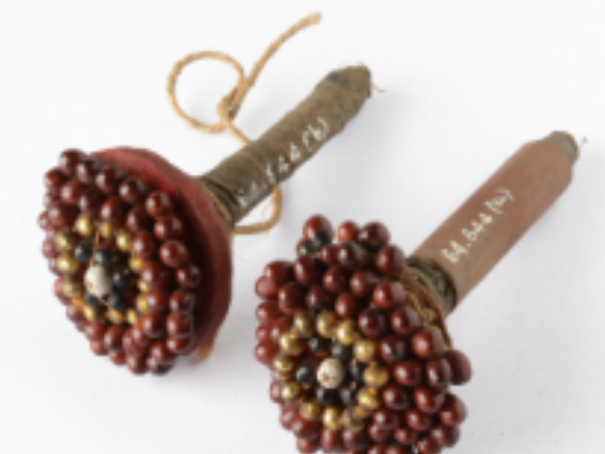 Crafted with red seeds and bamboo Crafted with red seeds and bamboo