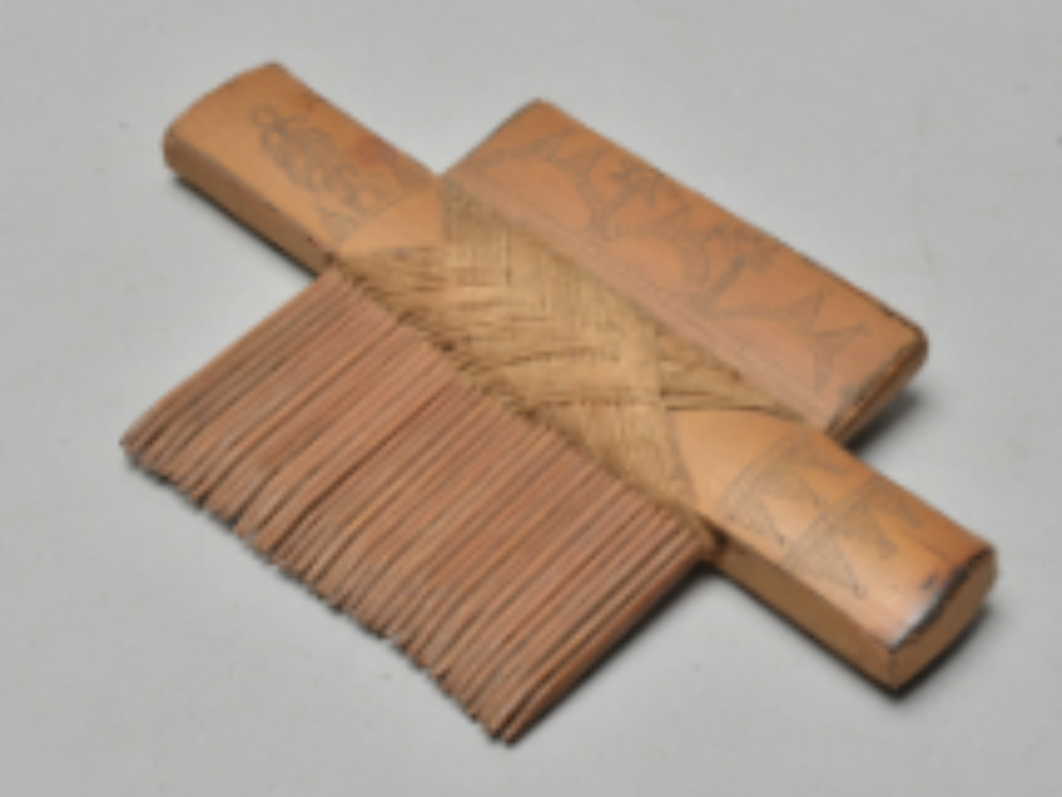 A Bamboo Comb with poker work A Bamboo Comb with poker work