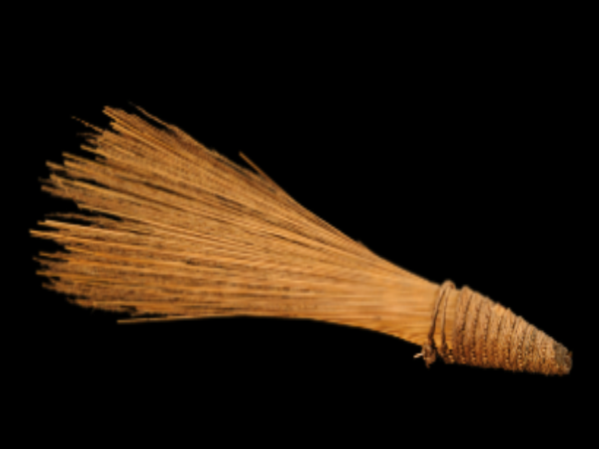 A handmade broomstick crafted from jungle grass A handmade broomstick crafted from jungle grass