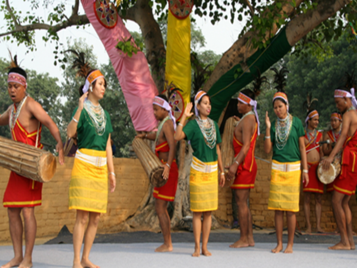 Garo men & women in their traditional dress during Wangala, a harvest festival celebrated by the Garo tribe Garo men & women in their traditional dress during Wangala, a harvest festival celebrated by the Garo tribe